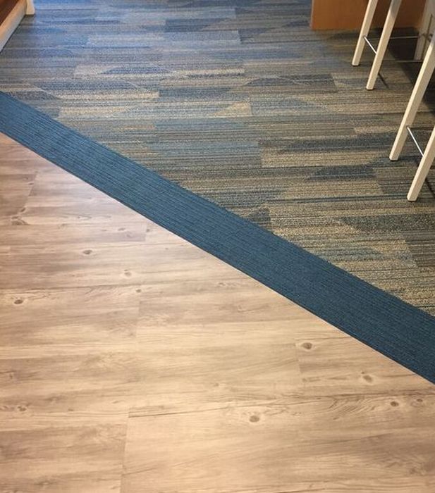 Woodgrain LVT and Carpet Tiles together for flooring with no transitions.